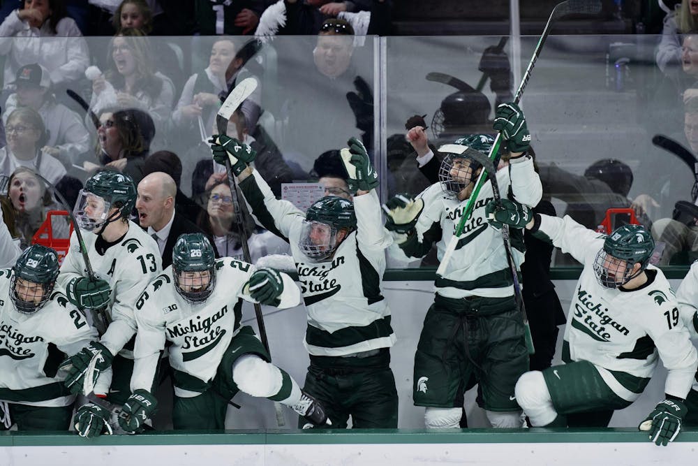 The Michigan State hockey bench celebrates following the game-winning goal at the BIG10 Championship game at Munn Ice Arena in East Lansing, Michigan on March 22, 2025: