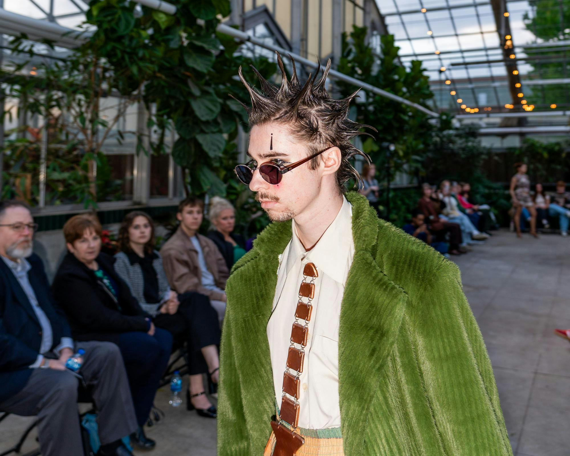 Crowd gathers for 'Studio 450' end of year fashion show at MSU Horticulture Gardens