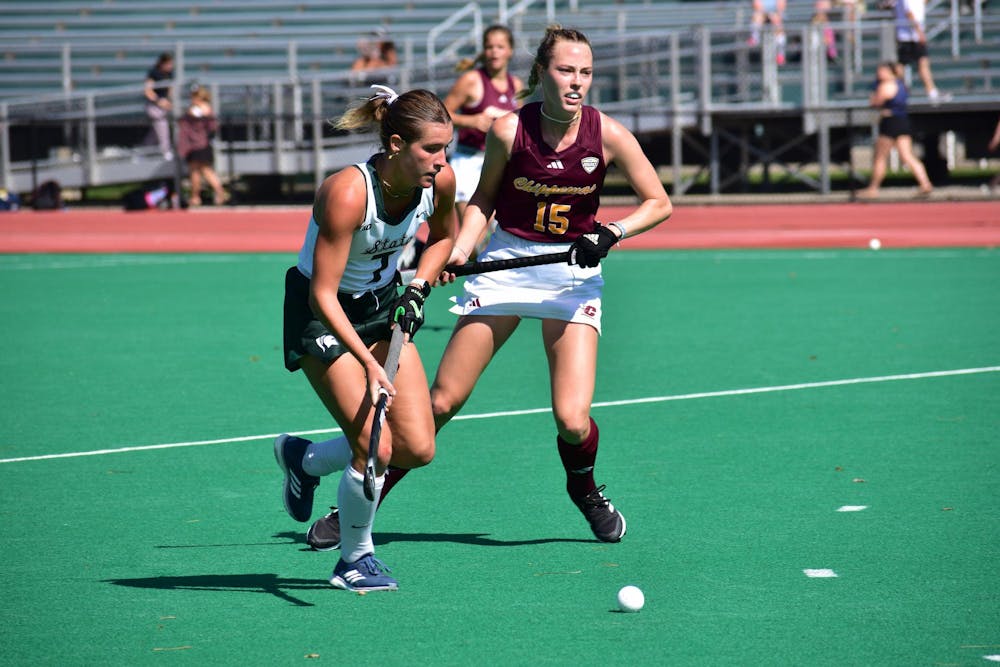 Michigan State women's field hockey senior midfielder Lulu Fulton, #7, drives the ball down the field in a game against Central Michigan at Ralph Young Field on Sept. 24, 2023. The Spartans won 3-0.