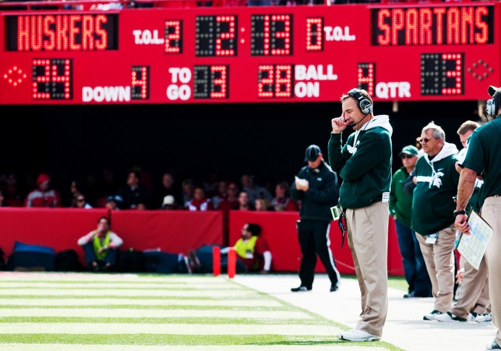 The third top-15 opponent in a row wasn't the charm for head coach Mark Dantonio, who looks away from the field as Nebraska retakes possession of the ball late in the forth quarter. The Cornhuskers defeated the Spartans, 24-3, on Saturday afternoon at Memorial Stadium in Lincoln, Neb. Josh Radtke/The State News