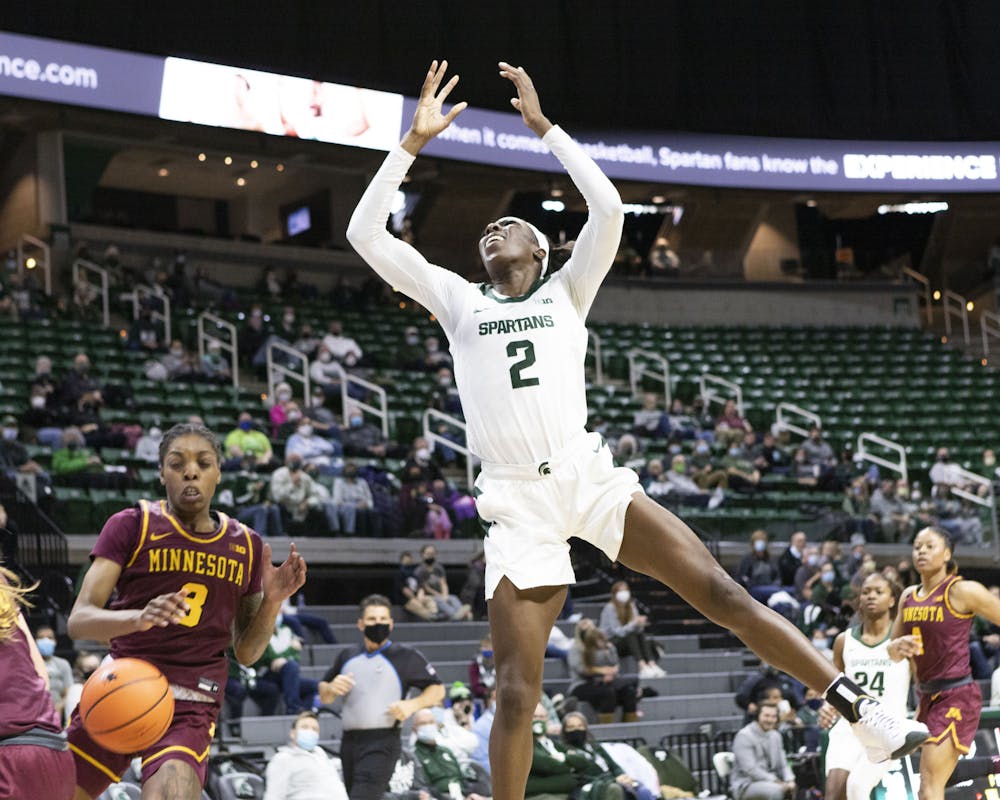 <p>As graduate student Tamara Farquhar leaps to shoot, the ball is knocked out of her hands by the Minnesota teams defense on Jan. 23, 2022.</p>