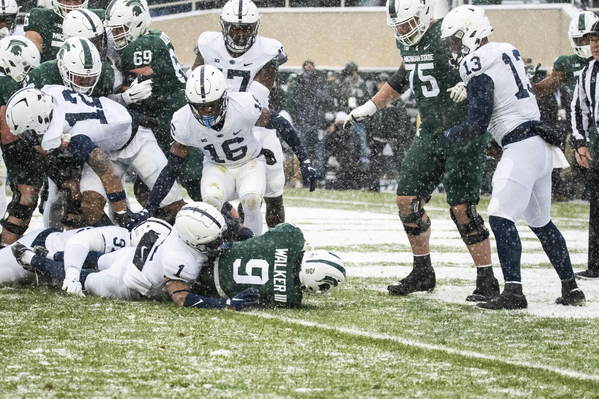 Walker (9) scores the first touchdown for the Spartans in Michigan State's match against the Penn State Nittany Lions at Spartan Stadium on Saturday, Nov. 27, 2021. 