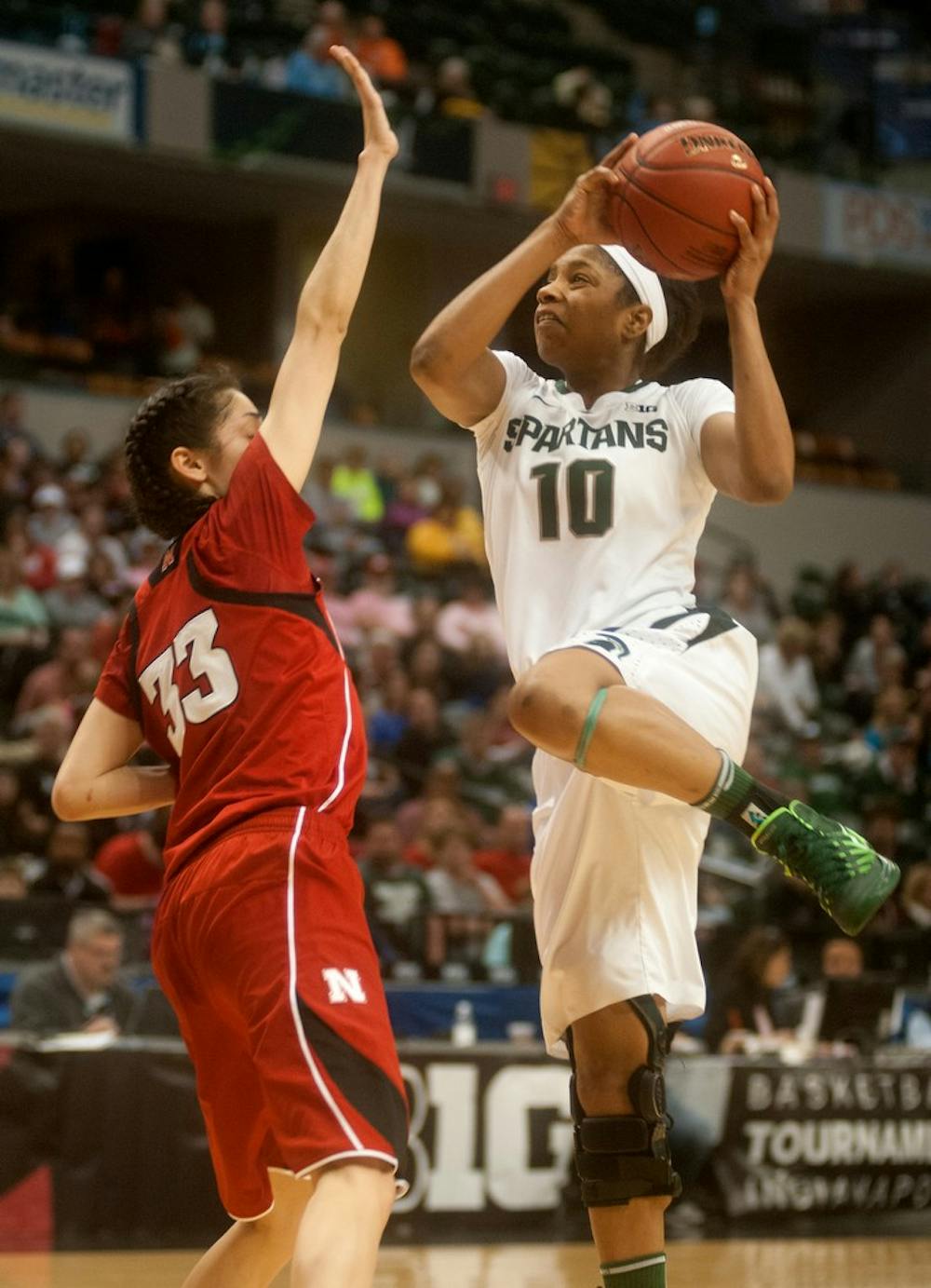 <p>Redshirt freshman guard Branndais Agee shoots the ball while Nebraska guard Rachel Theriot guards on March 8, 2014, at Bankers Life Fieldhouse in Indianapolis during the semi-finals of the Big Ten Tournament. The Cornhuskers defeated the Spartans, 86-58. Betsy Agosta/The State News</p>