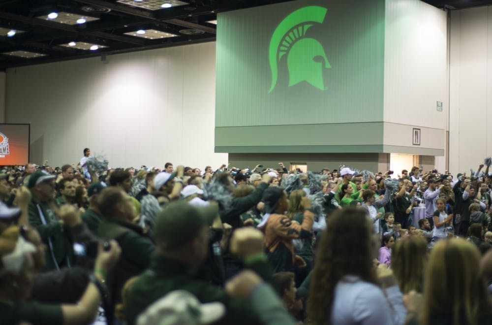 <p>Spartan fans cheer April 3, 2015, at a spartan pep rally at the Indiana Convention Center on South Capitol Avenue in Indianapolis, Indiana. MSU fans came together to celebrate the day before the final four game. Hannah Levy/The State News</p>