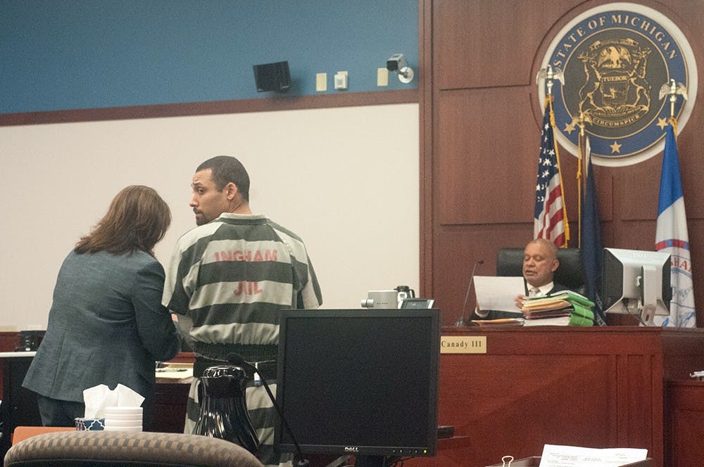 <p>Brandon Deval McLittle stands before Judge Clinton Canady III on May 27 at the Veterans Memorial Courthouse in Lansing. Asha Johnson/The State News</p>