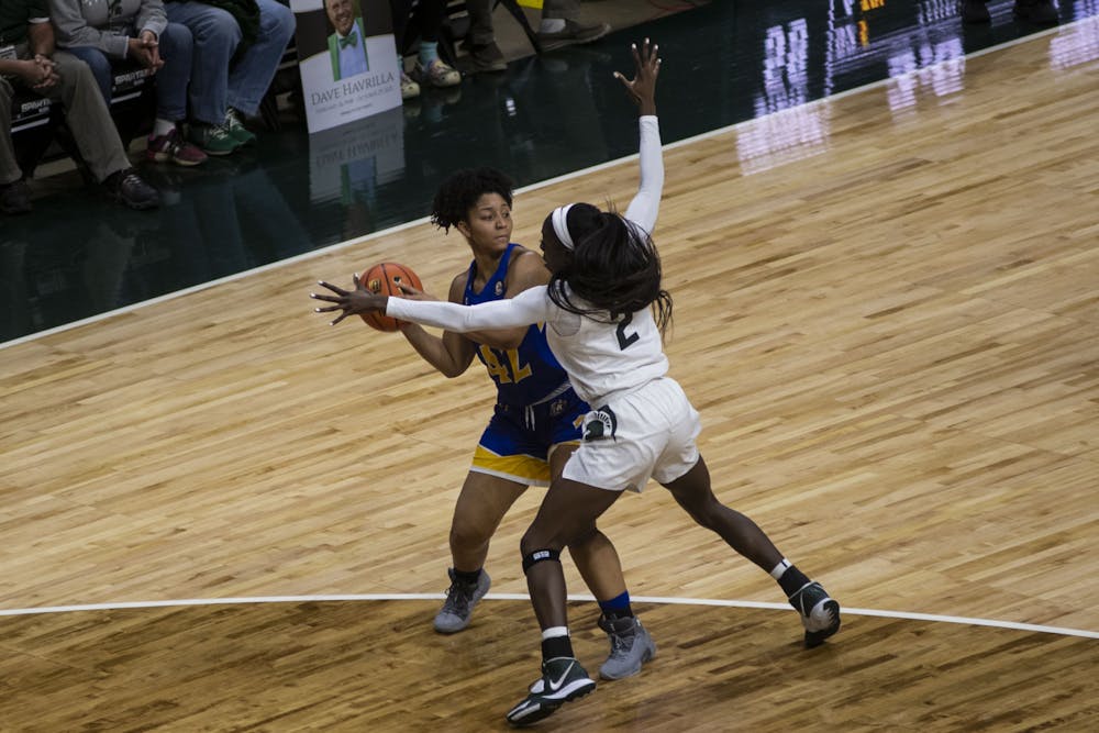 <p>Graduate forward Tamara Farquhar (2) guards Eagles senior guard Tyler Moore (42) in the Spartan’s match against Morehead State at the Breslin Center on Tuesday, Nov. 9, 2021. </p>