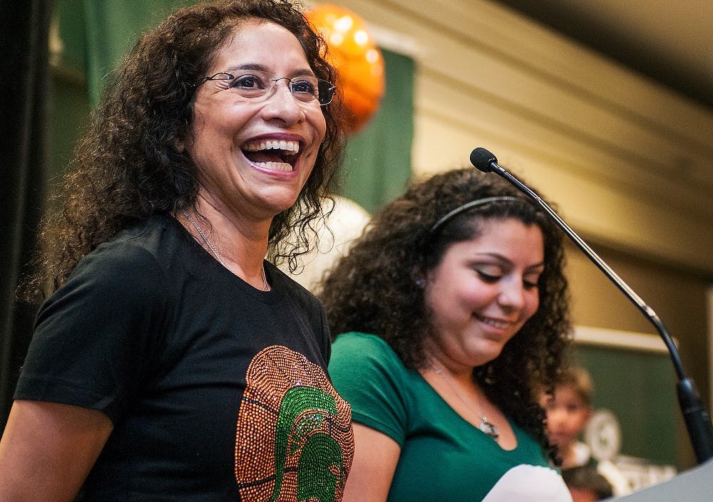 	<p>From left, Lupe and Raquel Izzo laugh while talking with the crowd during a pep rally before the game Friday, March. 29, 2013, at The Westin Indianapolis in Indianapolis, Ind. The Spartans will play the Duke Blue Devils in the fourth round of the <span class="caps">NCAA</span> Tournament. Adam Toolin/The State News</p>
