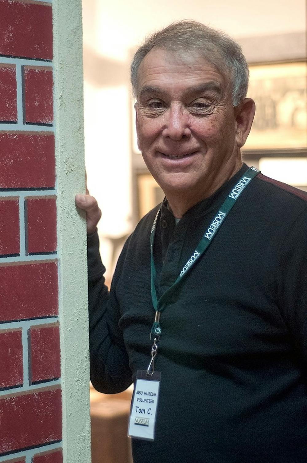 <p>MSU alumnus Tom Corwin poses for a portrait April 13, 2015, in the MSU museum. Corwin said he volunteers at the museum to keep himself busy in retirement. Kelsey Feldpausch/ The State News</p>