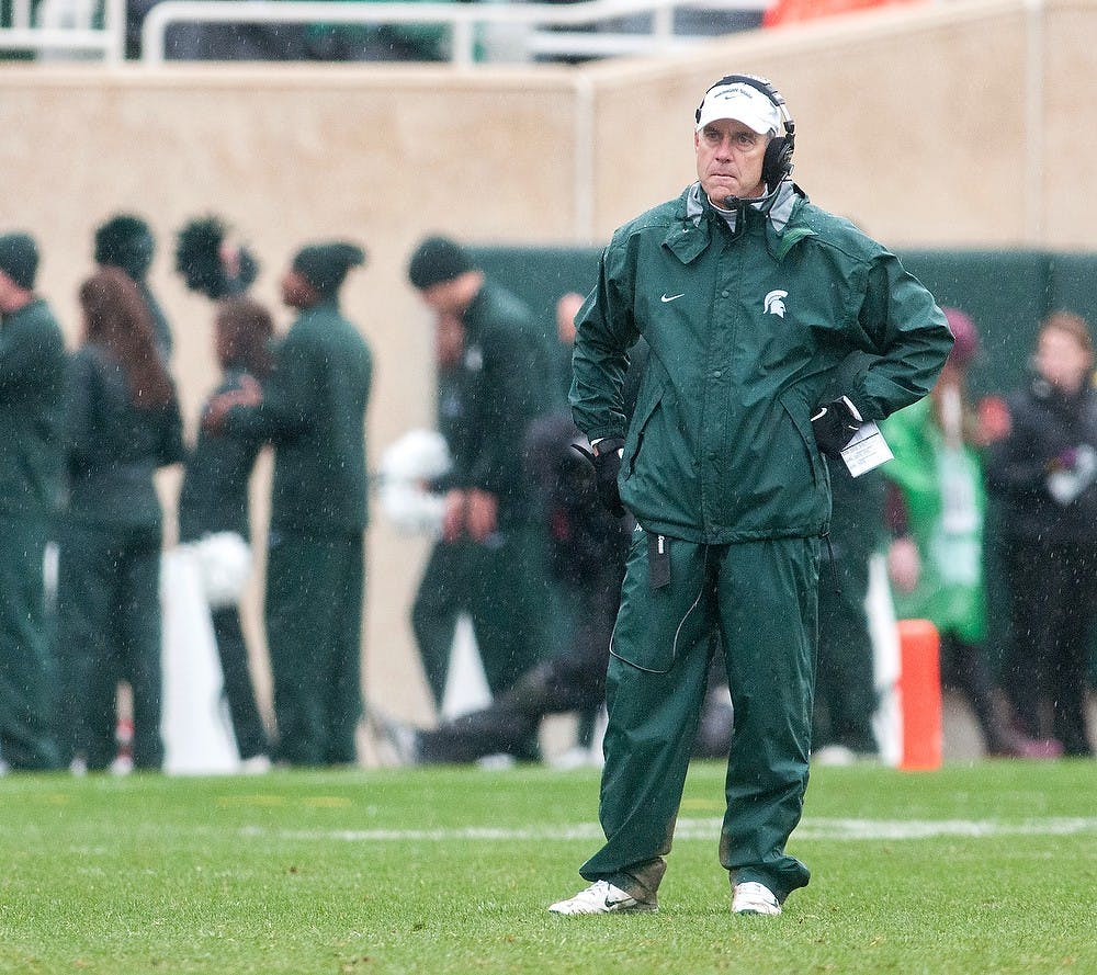 	<p>Head coach Mark Dantonio looks down the field at the second half of the game against Iowa on Saturday, Oct. 13, 2012 at Spartan Stadium. The team lost twice at home this season, breaking their home-winning stake since 2009. Julia Nagy/The State News</p>