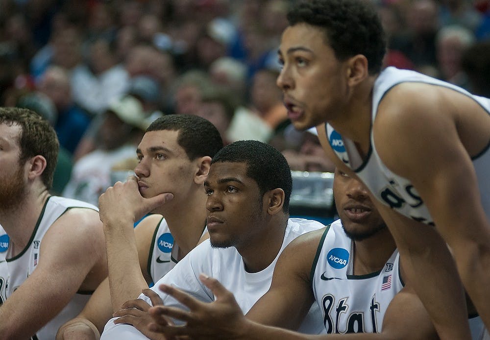 <p>The team watches from the bench Mar. 20, 2015, during the second round of the NCAA tournament in a game against Georgia at the Time Warner Cable Arena in Charlotte, North Carolina. The Spartans defeated the Bulldogs, 70-63. Alice Kole /The State News</p>