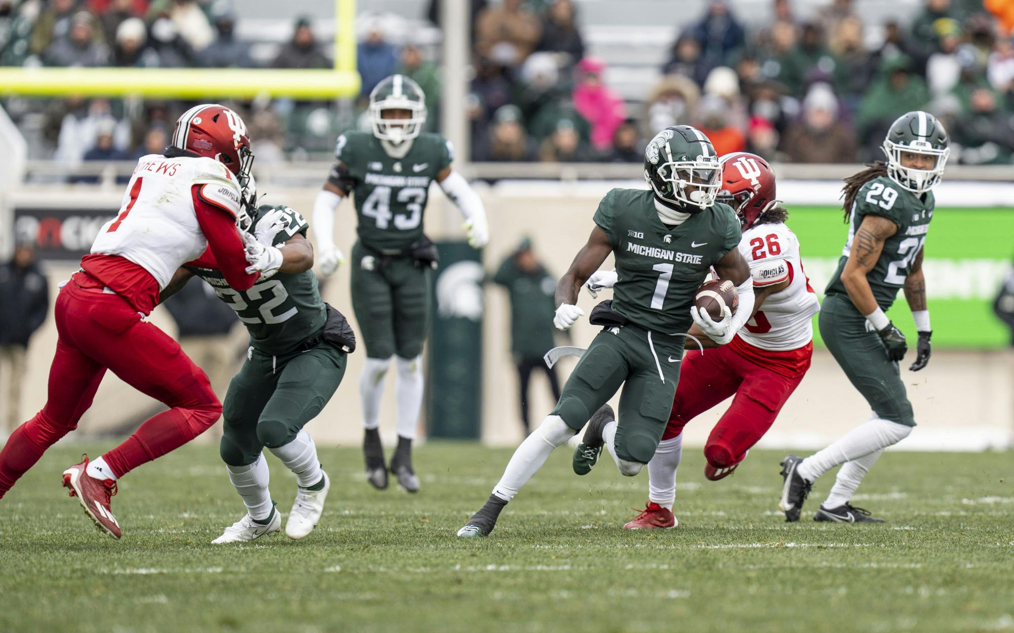 Redshirt senior Jayden Reed, 1, breaks through the Hoosier defense during Michigan State’s last game at home against Indiana on Saturday, Nov. 19, 2022 at Spartan Stadium. Indiana ultimately beat the Spartans, 39-31.
