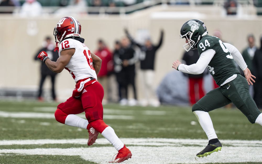 Jaylen Lucas, 12, runs ahead of Michigan State for a Hoosier touchdown during MSU’s game against Indiana on Saturday, Nov. 19, 2022 at Spartan Stadium. The Hoosiers ultimately beat the Spartans, 39-31.