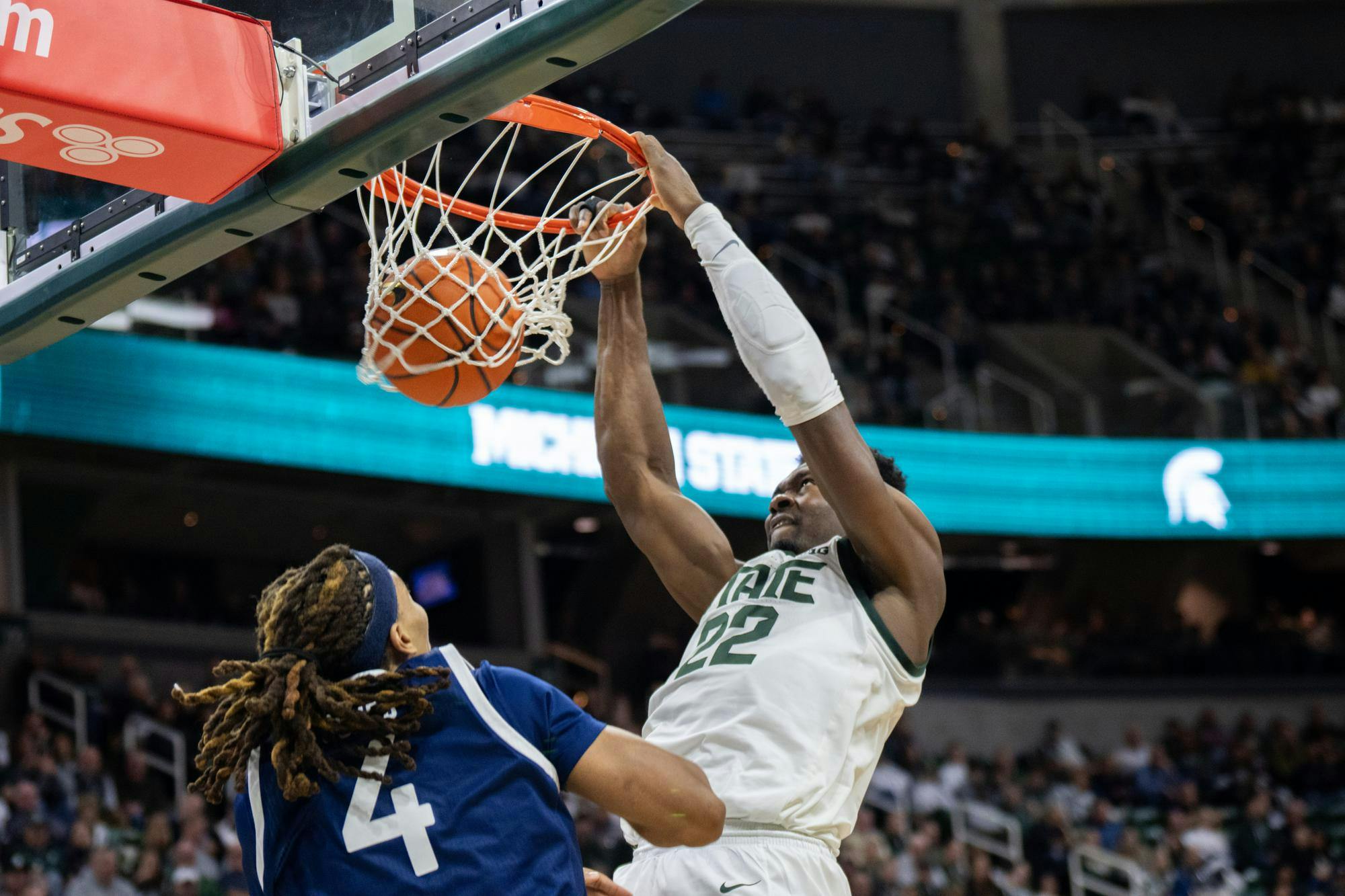 MSU Senior Center Mady Sissoko dunks on Georgia Southern Junior Center David Jones at the Jack Breslin Student Events Center on Nov. 28, 2023. Sissoko's Spartans would go on to win 86-55.