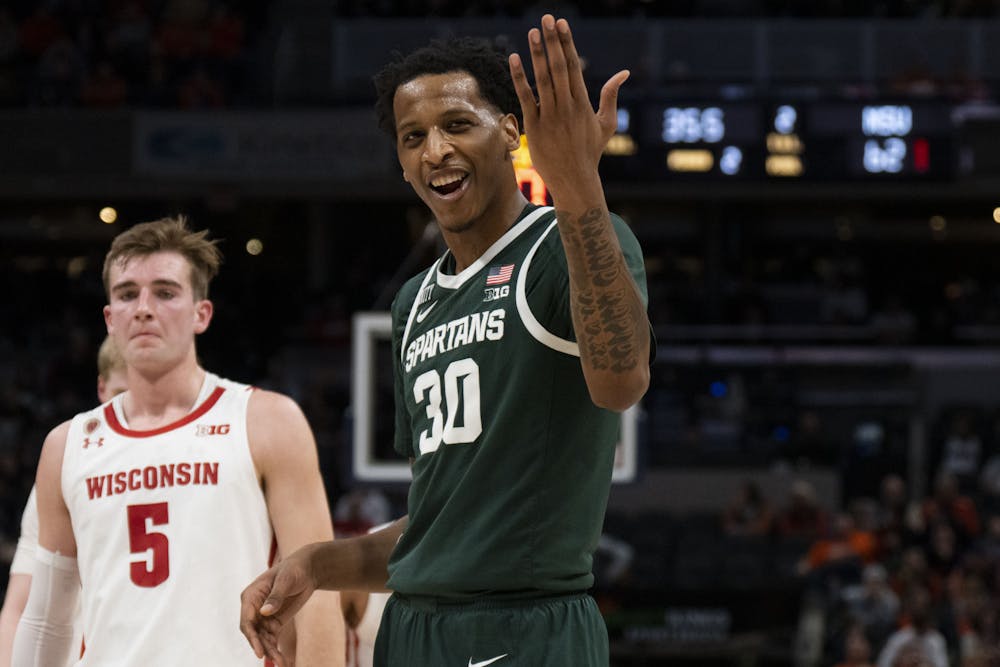 <p>Senior center Marcus Bingham Jr.  (30) revs up the crowd in the final minutes of Michigan State&#x27;s match against the Wisconsin Badgers in the quarter-finals of the B1G Tournament at Gainbridge Fieldhouse in Indianapolis, Indiana. Shot on March 11, 2022. </p>