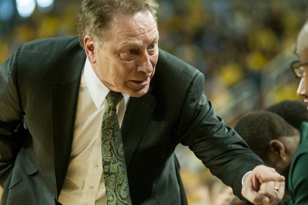 	<p>Head coach Tom Izzo converses with assistant coach Mike Garland during the game against Michigan on Feb. 23,  2014, at Crisler Center in Ann Arbor, Mich. The Spartans were defeated by the Wolverines, 79-70. Danyelle Morrow/The State News</p>