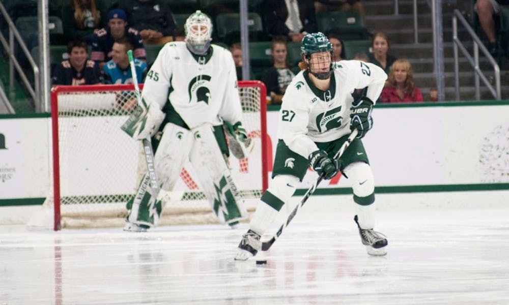 <p>Sophomore forward Mason Appleton (27) skates the puck up ice during an exhibition game against the University of Toronto on Oct. 2, 2016 at Munn Ice Arena. The Spartans defeated the Blues 2-1 in an overtime shootout after ending regulation in a 2-2 tie.</p>