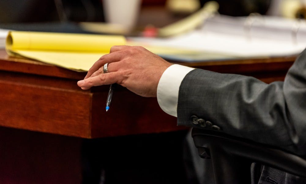 Defense attorney John Dakmak looks over his notes during the trial of Dr. William Strampel, former dean of the MSU College of Osteopathic Medicine, at the Ingham County Circuit Court on June 4, 2019.