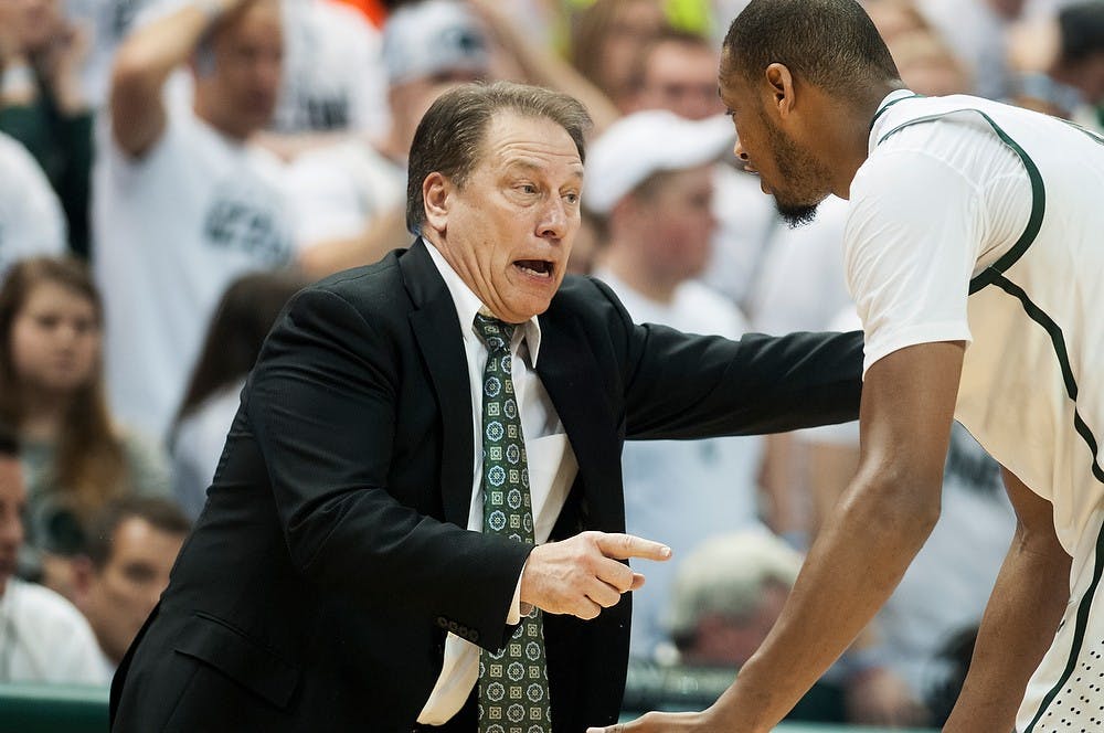 	<p>Men&#8217;s basketball coach Tom Izzo talks with senior center Adreian Payne during the game against Ohio State on Jan. 7, 2014, at Breslin Center. Payne was one of the top shooters of the game, scoring 18 points. Danyelle Morrow/The State News</p>