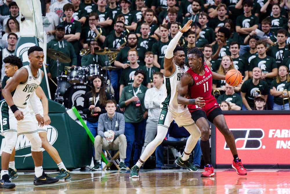 <p>Junior center Mady Sissoko (22) defends a Rutgers player during a matchup at the Breslin Center on Jan. 19, 2023. The Spartans defeated the Scarlet Knights 70-57.</p>
