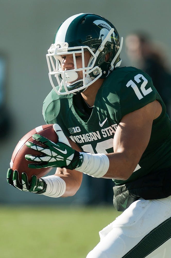 	<p>Freshman wide receiver R.J. Shelton returns a kick from Minnesota on Nov. 30, 2013, at Spartan Stadium. The Spartans defeated the Golden Gophers, 14-3. Danyelle Morrow/The State News</p>