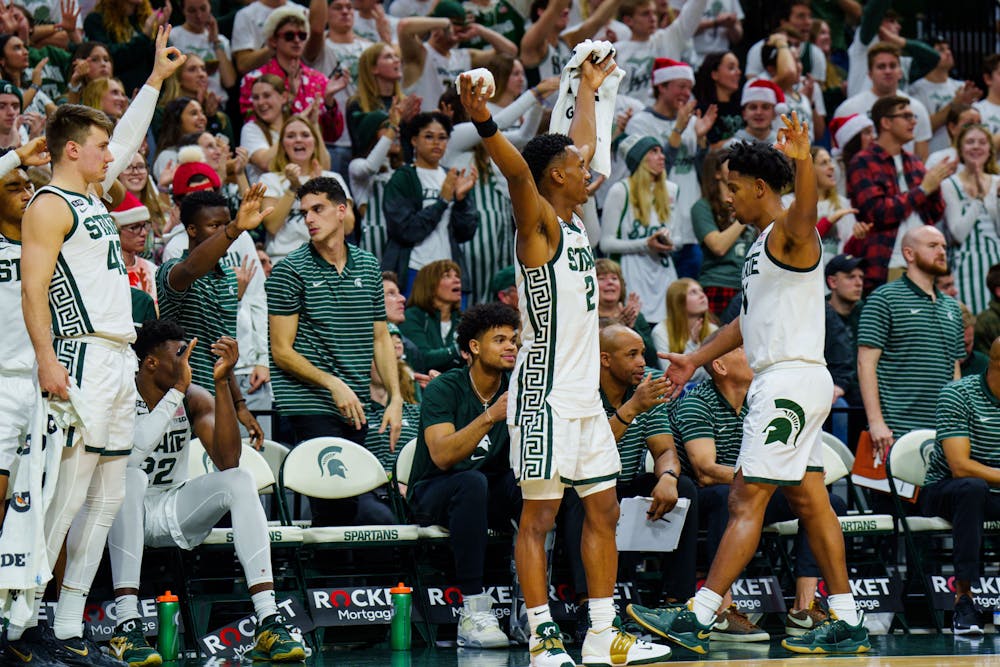 Senior guard Tyson Walker (2) celebrates a basket during a game against Brown, held at the Breslin Center on Dec. 10, 2022. The Spartans defeated the Bears 68-50.