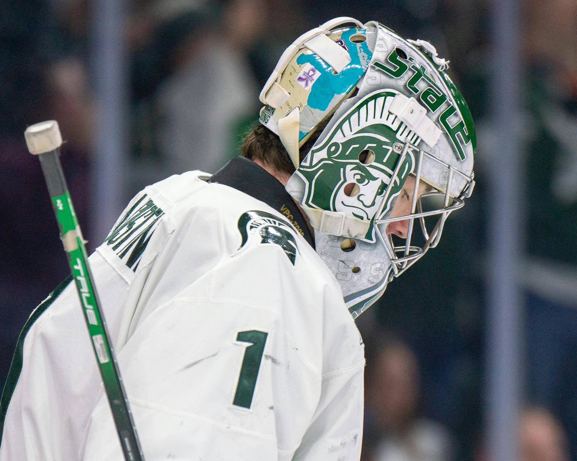 <p>Freshman goalie Trey Augustine (1) and his mask with many designs during a game against University of Michigan at Munn Ice Arena on March 23, 2024.</p>