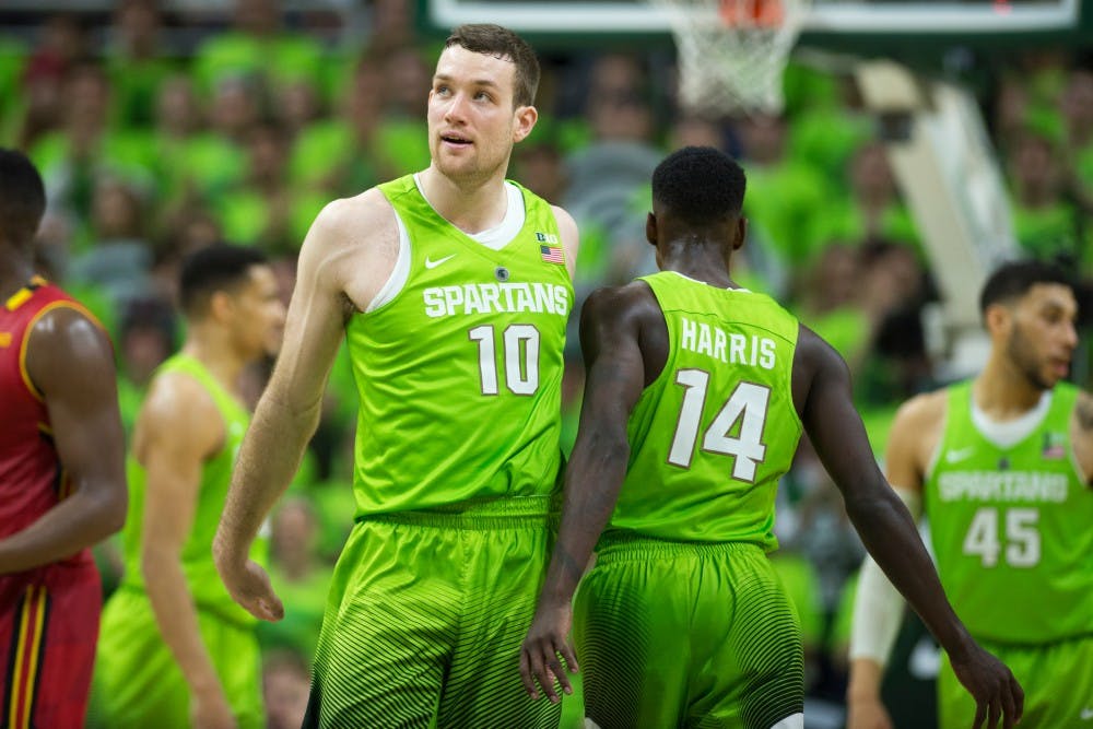 Senior guard Matt Costello high fives junior guard Eron Harris after scoring a basket during the game against Maryland on Jan. 23, 2016 at Breslin Center. The Spartans defeated the Terrapins, 74-65.