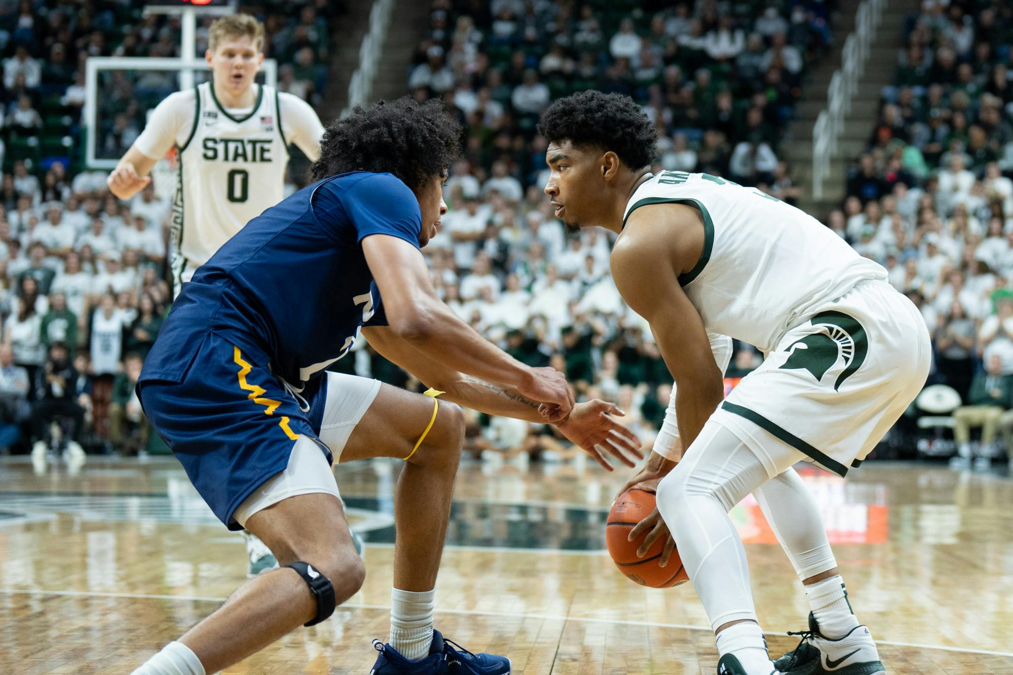 <p>Sophomore guard Jaden Akins stares down his defender during the Spartans' 73-55 win over Northern Arizona on Nov. 7, 2022.</p>