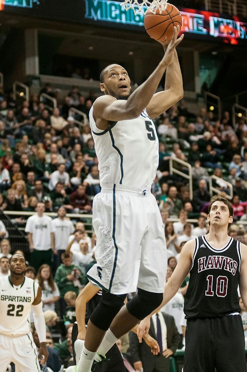 	<p>Senior center Adreian Payne goes up for a jump shot during the game against Indiana University of Pennsylvania, Nov. 4, 2013, at Breslin Center. The Spartans beat the Crimson Hawks, 83-45. Danyelle Morrow/The State News</p>