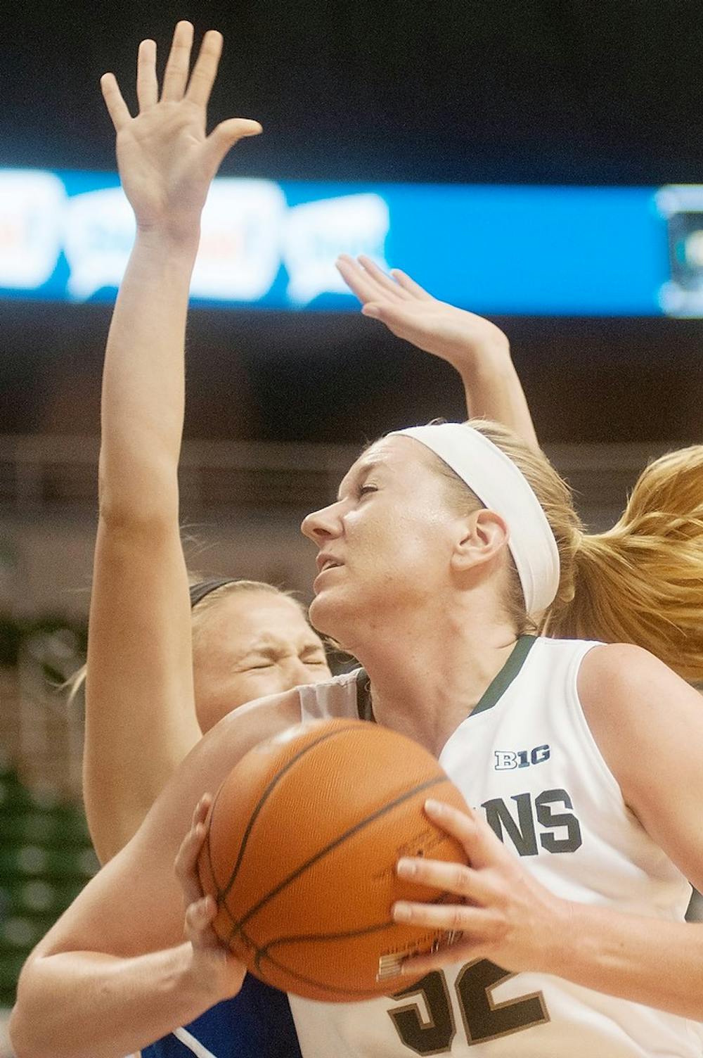 	<p>Junior forward Becca Mills goes up to the basket on Nov. 3, 2013, during the game against Grand Valley State at Breslin Center. The Spartans defeated the Lakers, 91-47. Khoa Nguyen/The State News</p>