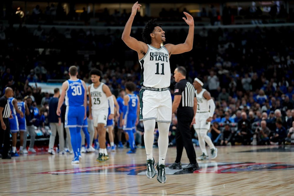 <p>Senior guard A.J. Hoggard (11) hypes up the crowd during the second half of the Champions Classic at the United Center on Nov. 14, 2023. The Spartans fell to the Blue Devils with a score of 74-65.</p>