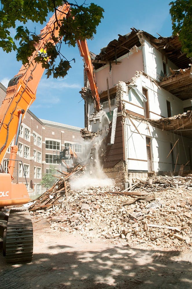 	<p>Morrill Hall demolition continues June 4, 2013. Demolition started June 3, 2013. Weston Brooks/The State News</p>