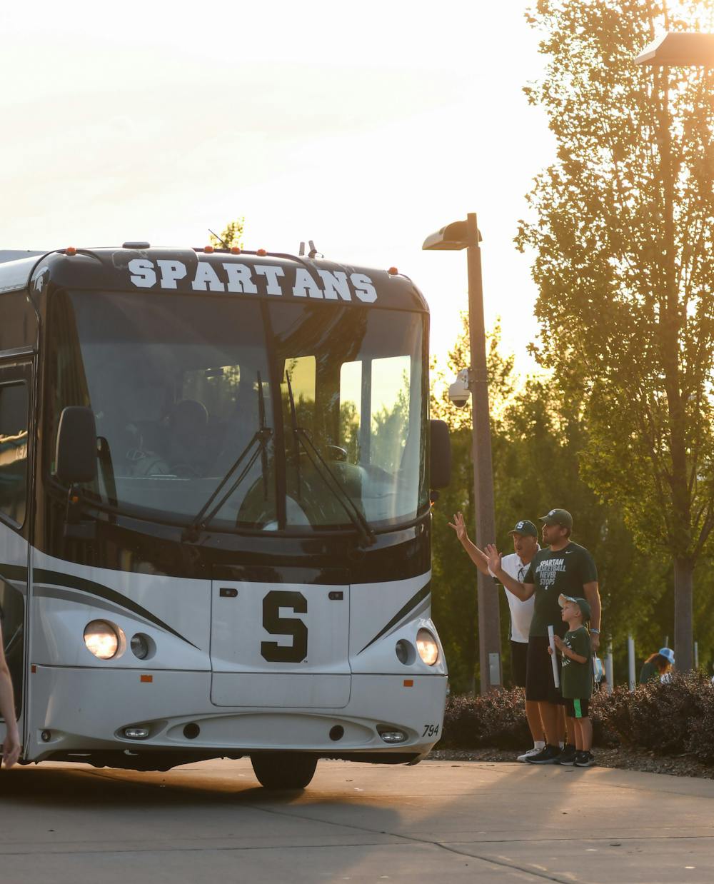 <p>Fans wave the team goodbye as the players are bussed away from Spartan Stadium after the 18th annual &quot;Meet the Spartans&quot; event on Monday, August 23, 2021. </p>