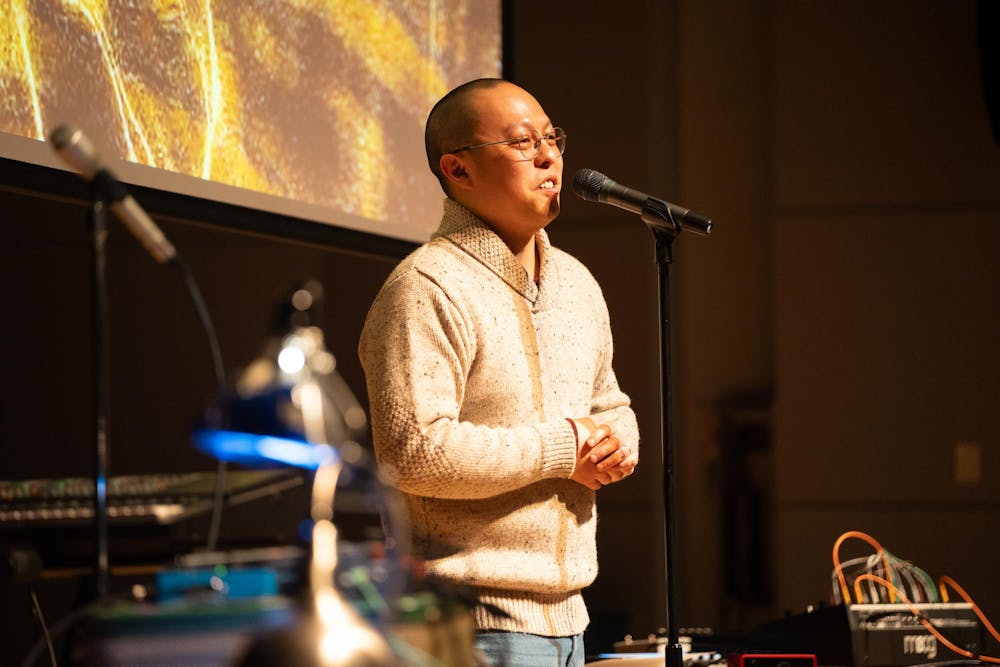 Austin Oting Har, a faculty member in Michigan State University’s Residential College in the Arts and Humanities, speaks about the relationship between music and poetry, describing them as “kindred in spirits,” during the event for Dennis Hinrichsen in East Lansing, Mich., on Feb. 25, 2026.