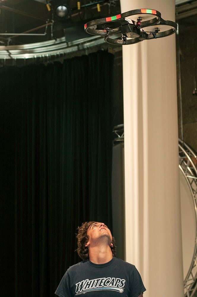 	<p>Graduate student Greg Monahan poses for the drone above him in the Lab Environmental Reporting journalism class on Sept. 19, 2013. Margaux Forster/The State News</p>