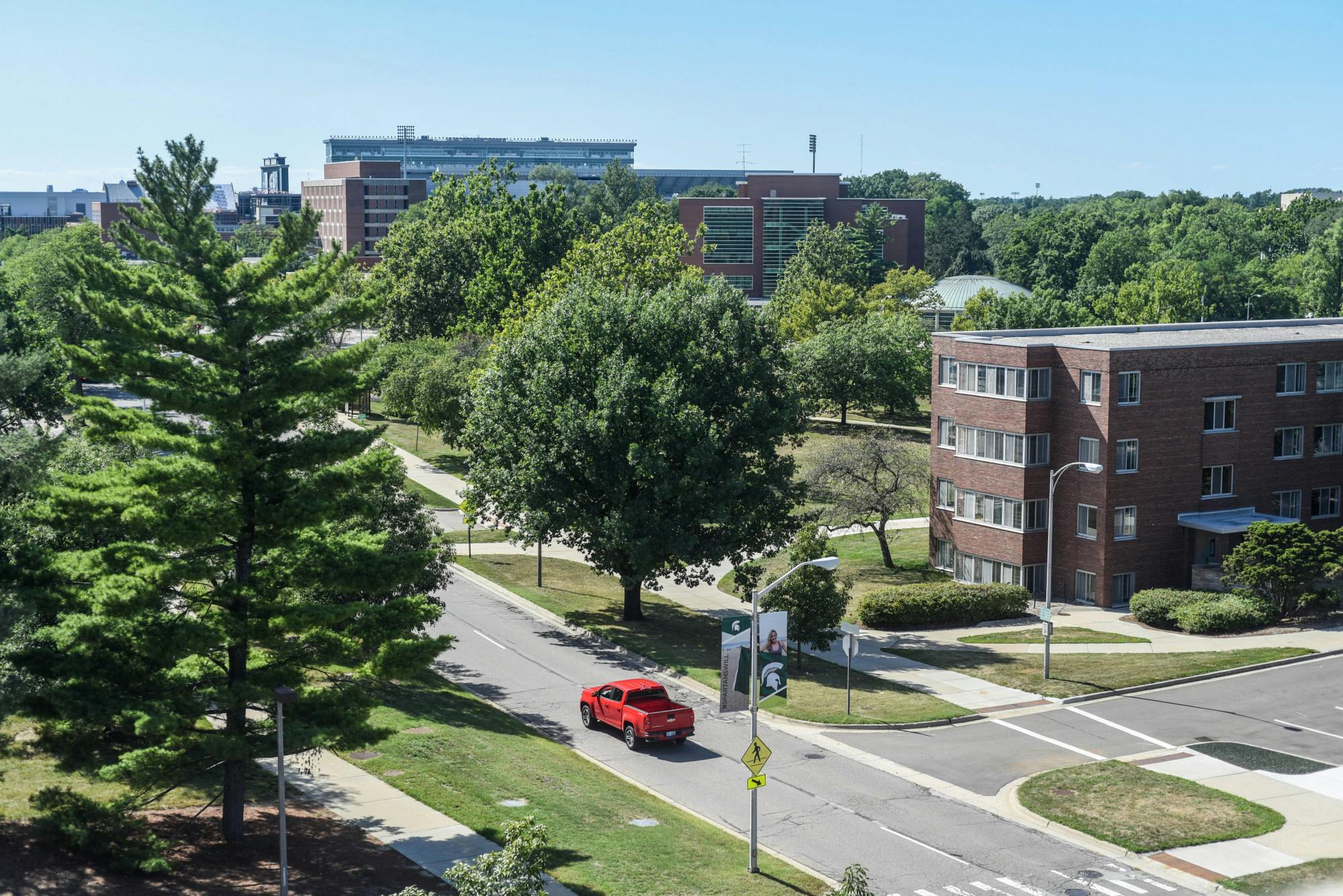 A car drives through campus on Aug. 11, 2020.
