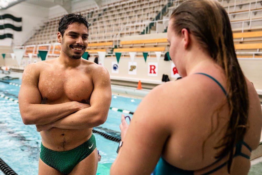 Michigan State electrical engineering junior Miguel Gonzalez talks with a teammate after practice during Michigan State Swim Club practice at the IM West Fitness Center on Michigan State University’s campus in East Lansing, Mich., on Tuesday, May 7, 2026.