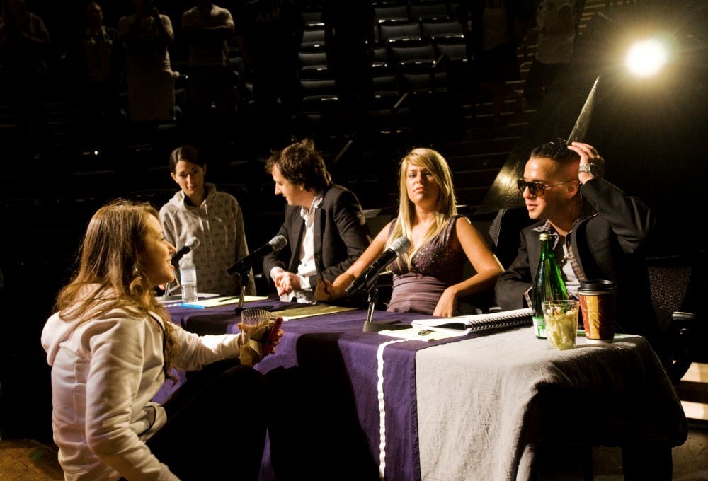 Ben Green, left, Ashley Gerke, center, and Mike "The Situation" Sorrentino, right, act as judges on Friday as a part of YOBI.tv's online series at the Wharton Center's Pasant Theatre. The series is similar to the popular television show "American Idol," where people from around the United States showcase their talents in search of their dreams. Mo Hnatiuk/The State News