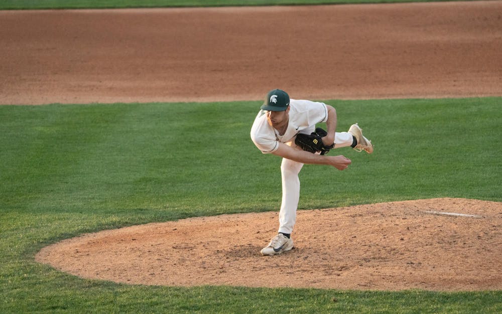 <p>MSU pitcher Andrew Carson balances on one leg after throwing a pitch at McLane Baseball Stadium on Friday, April 14, 2023. Carson recorded a 3.67 ERA against the Leathernecks.</p>