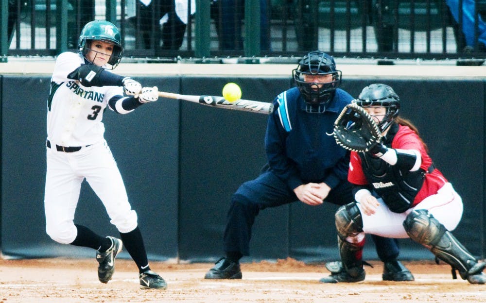 Sophomore outfielder Kylene Hopkins swings the bat to hit the ball during Saturday's game against Wisconsin at Secchia Stadium. The Spartans defeated the Badgers, 8-0, in the fifth inning. Lauren Wood/The State News