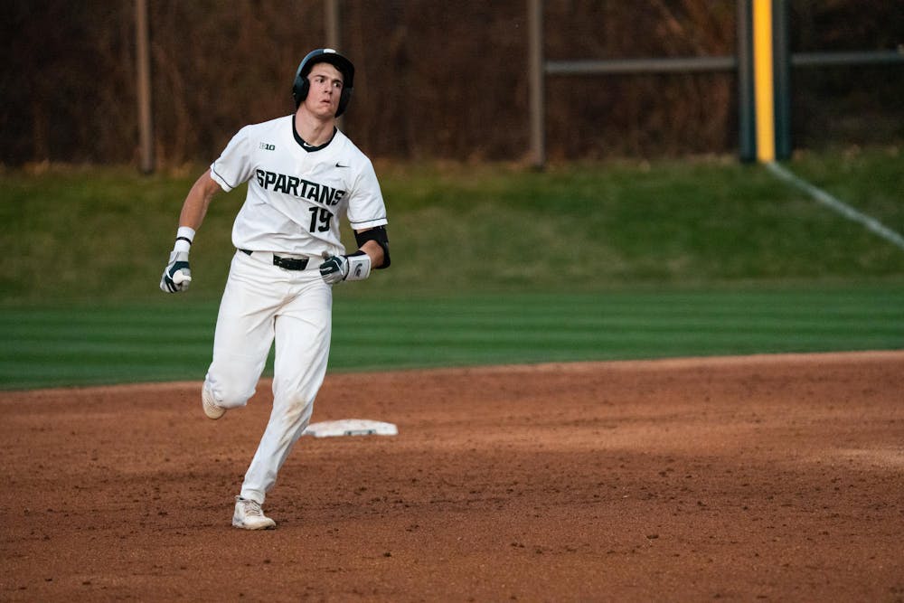<p>Redshirt sophomore Bryan Broecker rounds the bases after crushing a home run at McLane Baseball Stadium on Friday, April 14, 2023. The homer was the Spartan's third of the day.</p>