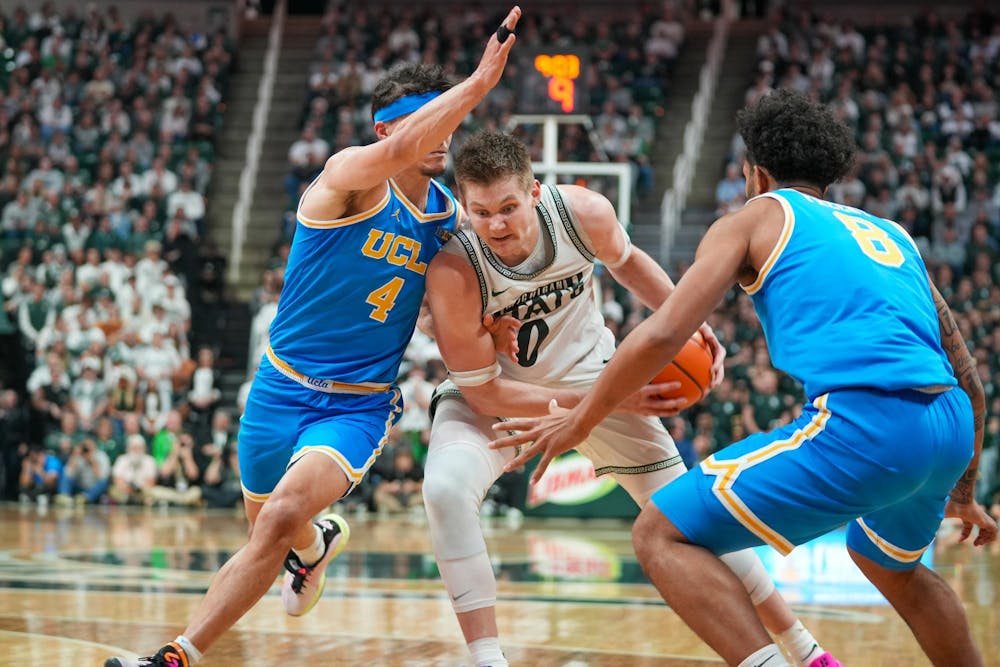 <p>Michigan State senior forward Jaxon Kohler (0) dribbles through contact against UCLA at the Breslin Center in East Lansing, Michigan, on Tuesday, Feb. 17, 2026.</p>