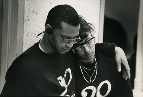 <p>A male student sits with his arm around a female student, who both appear to be napping or resting their eyes. This happened during the student occupation of the Hannah Administration Building in May&nbsp;1989. Photo originally taken by The State News, courtesy of&nbsp;MSU University&nbsp;Archives and Historical Collections.</p>