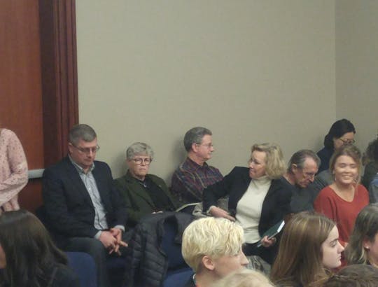 <p>MSU President Lou Anna K. Simon (back middle) talks to MSU Board Trustee Melanie Foster at the second day of ex-MSU Dr. Larry Nassar's sentencing in Ingham County.</p>