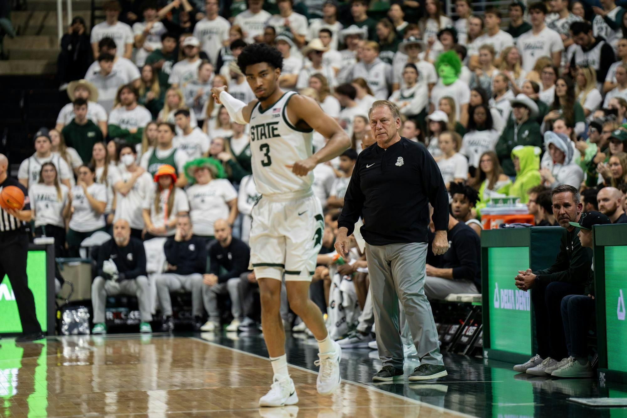 <p>MSU Head Coach Tom Izzo scowls following a sideline conference with Junior Guard Jaden Akins (3) during their game against Georgia Southern at the Jack Breslin Student Events Center on Nov. 28, 2023. Izzo's Spartan squad defeated Georgia Southern 86-55.</p>