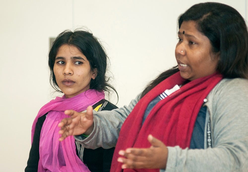 	<p>Executive director of the Bangladesh Center for Worker Solidarity Kalpona Akter, right, translates for Rana Plaza factory collapse survivor Reba Sikder during a talk hosted by the <span class="caps">MSU</span> United Students Against Sweatshops on Feb. 19, 2014, in the Mosaic Multicultural Unity Center of the Union. &#8220;We are fighting,&#8221; Akter said, while speaking to promote worker safety. Danyelle Morrow/The State News</p>