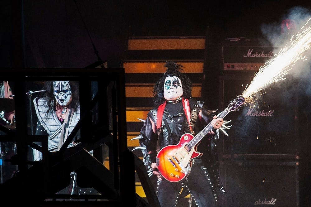 Head Coach Tom Izzo performs Oct. 24, 2014, during Midnight Madness at Breslin Center. Head Coach Suzy Merchant performed as Beyonce and Izzo performed as a member of KISS.