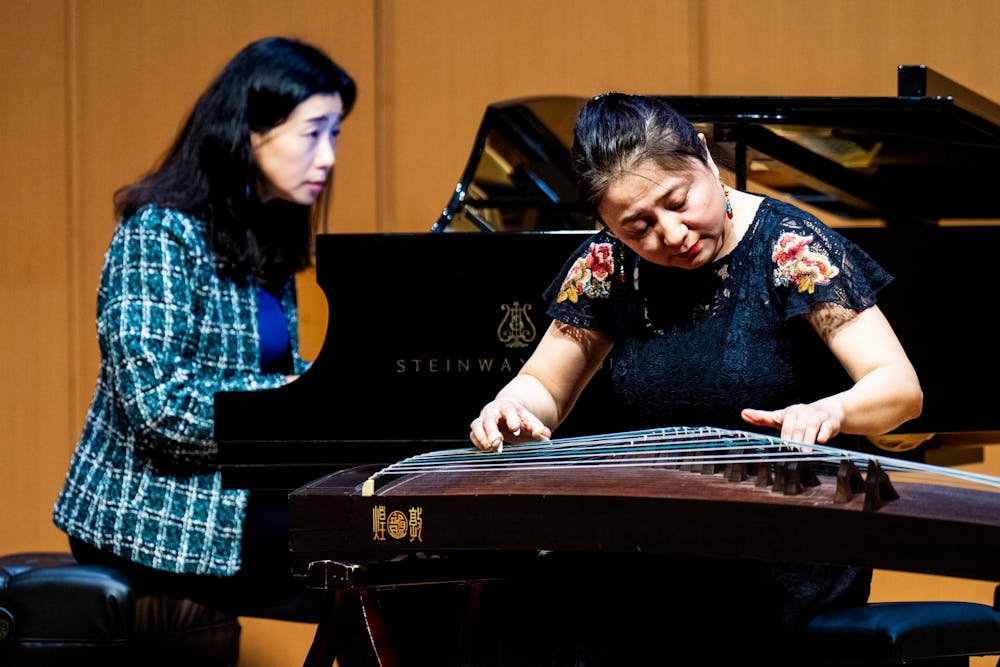 Young Hyun Cho, associate professor of piano at Michigan State University, performs alongside guest artist Haiqiong Deng during a Lunar New Year concert at Cook Recital Hall in the Michigan State University School of Music in East Lansing, Mich., on Sunday, Feb. 22, 2026. Deng plays the guzheng, a traditional Chinese plucked zither with more than 2,500 years of history, typically featuring 21 strings stretched over movable bridges and known for its expressive glissandos and pitch bends.