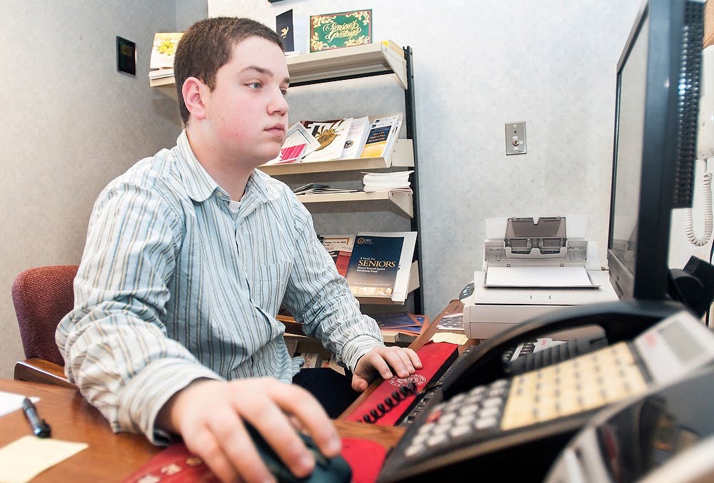 	<p>Social relations and policy sophomore Hersh Merenstein works at his desk Wednesday, Jan. 9, 2013, at the Boji Tower, 124 Allegan Street, Lansing. Almost 15% of state of Michigan employees are eligible for retirement next year, leading to more job opportunities for student interns. Adam Toolin/The State News</p>