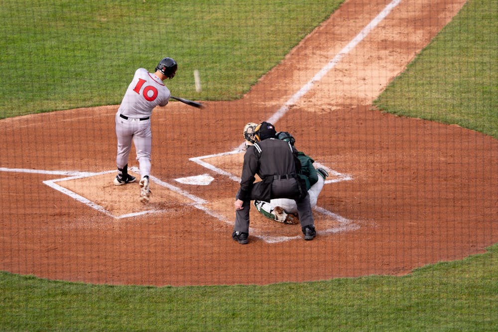 <p>Lansing Lugnuts first baseman Will Simpson gets a hit off a Spartan pitcher during the "Crosstown Showdown" at Jackson Field in Lansing, MI on Wednesday, April 3, 2024. Simpson went 3-5 at the plate during the Wednesday evening game.</p>